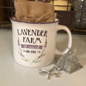 Lavender farm tea cup with tea and infuser.